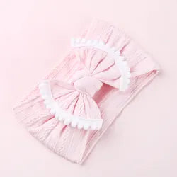 Cable knit pompom bow headband