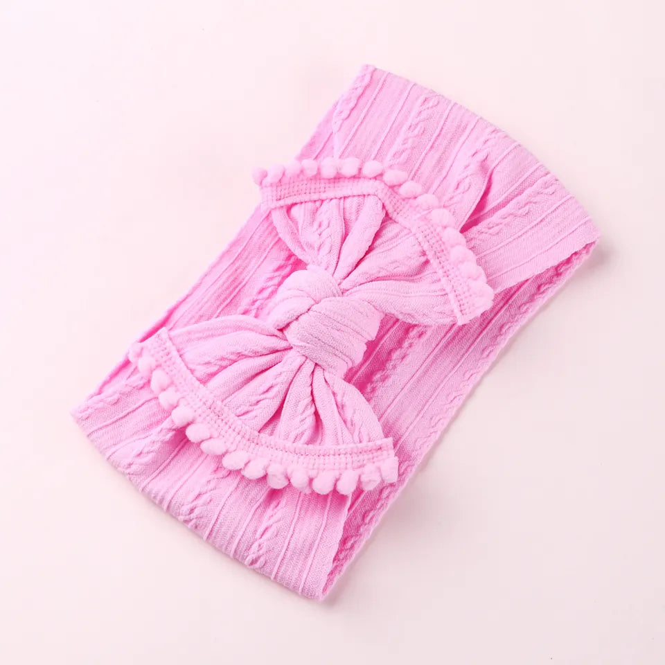 Cable knit pompom bow headband