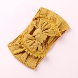 Cable knit pompom bow headband
