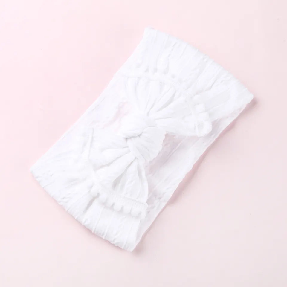 Cable knit pompom bow headband
