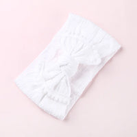 Cable knit pompom bow headband