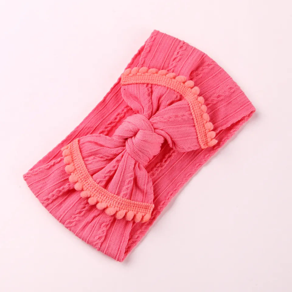Cable knit pompom bow headband