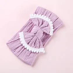Cable knit pompom bow headband