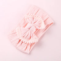 Cable knit pompom bow headband