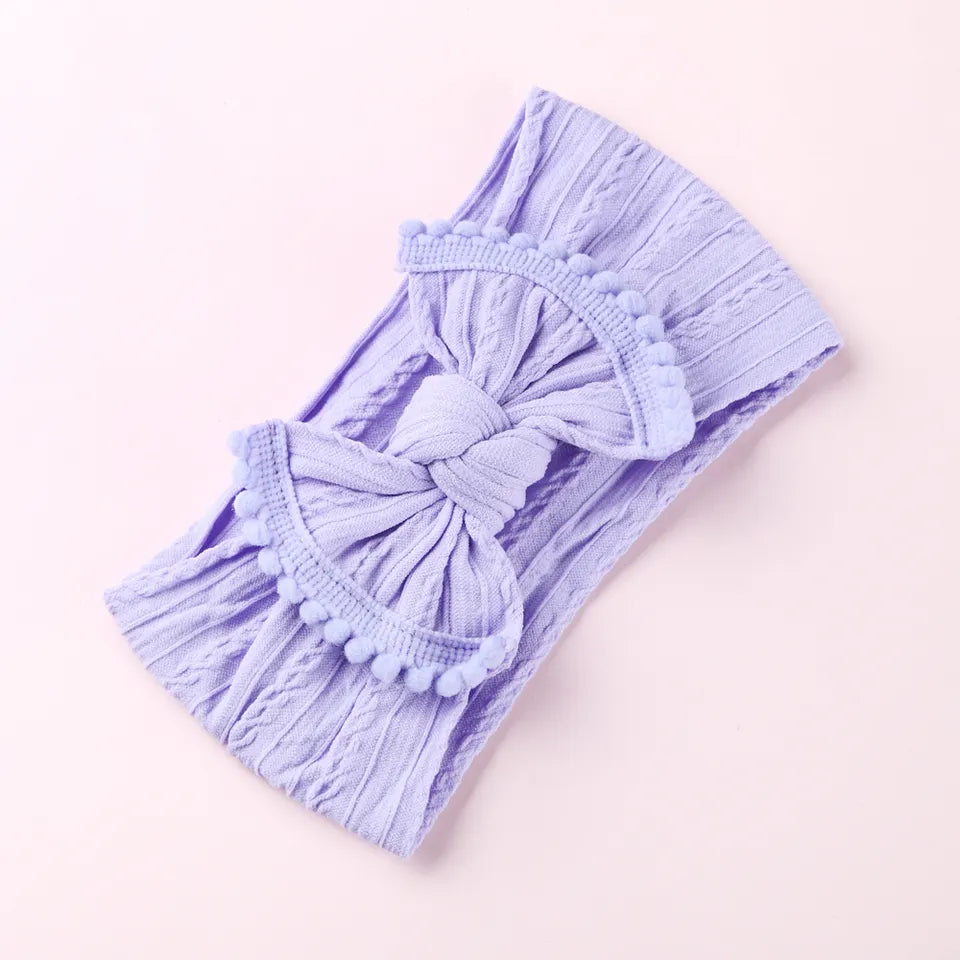 Cable knit pompom bow headband