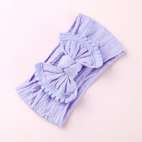 Cable knit pompom bow headband
